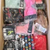 The photo shows a package with clothing in the category AU.