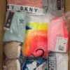 The photo shows a package with clothing in the category AU.