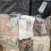 The photo shows a package with clothing in the category B.