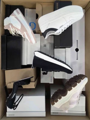 The photo shows a package with footwear in the category BS.