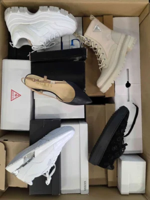 The photo shows a package with footwear in the category BS.