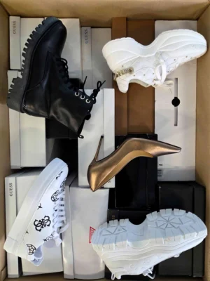 The photo shows a package with footwear in the category BS.