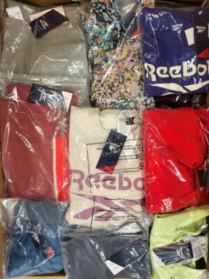 The photo shows a package with clothing in the category R.