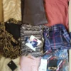 The photo shows a package with clothing in the category TSC.