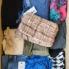 The photo shows a package with clothing in the category TSC.