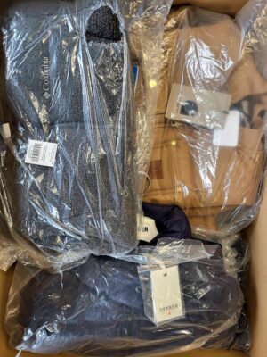 The photo shows a package with clothing in the category AJW.