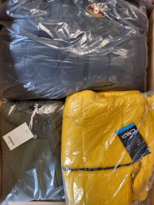 The photo shows a package with clothing in the category AJW.