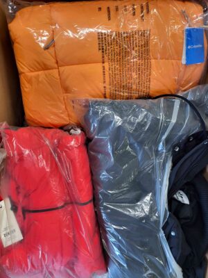 The photo shows a package with clothing in the category AJW.