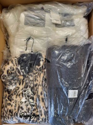 The photo shows a package with clothing in the category AJW.