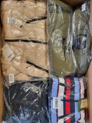 The photo shows a package with clothing in the category AJW.