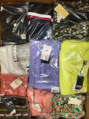 The photo shows a package with clothing in the category AW.