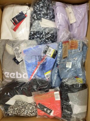 The photo shows a package with clothing in the category AW.