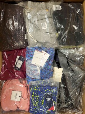The photo shows a package with clothing in the category AW.