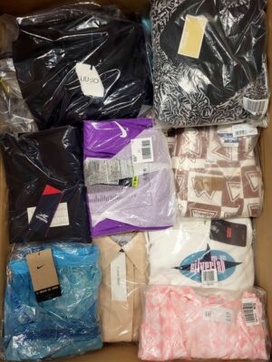 The photo shows a package with clothing in the category AW.