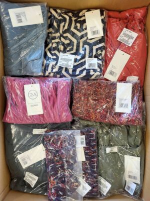 The photo shows a package with clothing in the category YA.