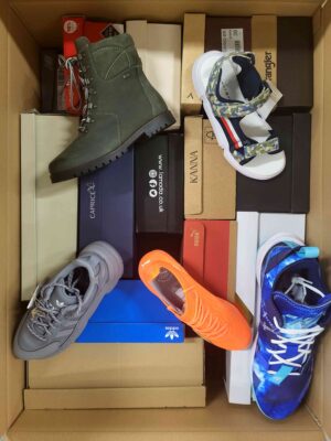 The photo shows a package with footwear in the category AS.