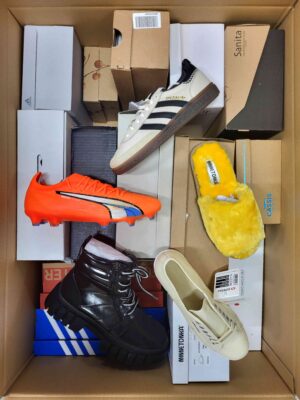 The photo shows a package with footwear in the category AS.