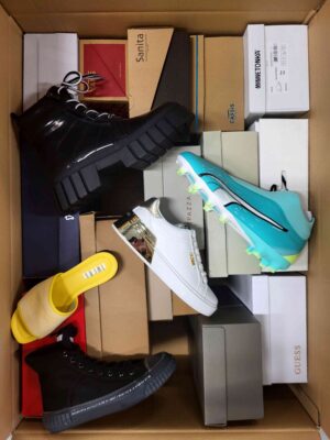The photo shows a package with footwear in the category AS.