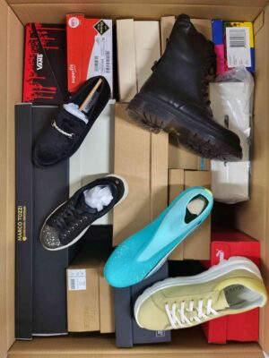 The photo shows a package with footwear in the category AS.