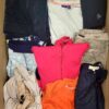 The photo shows a package with clothing in the category U.
