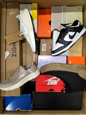 The photo shows a package with footwear in the category BS.