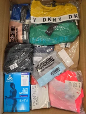 The photo shows a package with clothing in the category AU.
