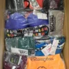 The photo shows a package with clothing in the category AU.