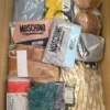 The photo shows a package with clothing in the category AU.