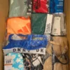 The photo shows a package with clothing in the category AU.