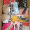 The photo shows a package with clothing in the category AU.