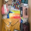 The photo shows a package with clothing in the category AU.