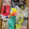 The photo shows a package with clothing in the category AU.