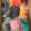 The photo shows a package with clothing in the category AU.