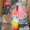 The photo shows a package with clothing in the category AU.