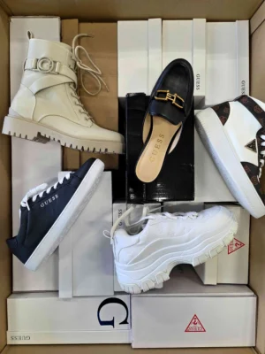 The photo shows a package with footwear in the category BS.