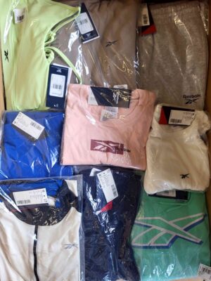 The photo shows a package with clothing in the category R.