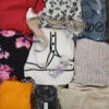 The photo shows a package with clothing in the category SN.