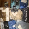 The photo shows a package with clothing in the category AM.