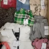 The photo shows a package with clothing in the category TSC.
