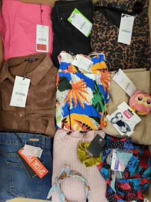 The photo shows a package with clothing in the category TSC.