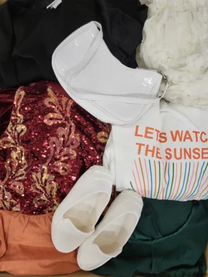 The photo shows a package with clothing in the category SN.