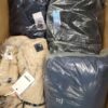 The photo shows a package with clothing in the category AJW.