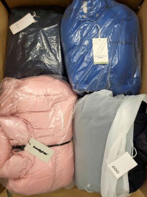 The photo shows a package with clothing in the category AJW.