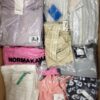 The photo shows a package with clothing in the category AW.