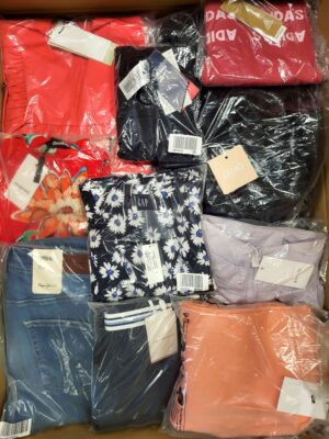 The photo shows a package with clothing in the category AW.