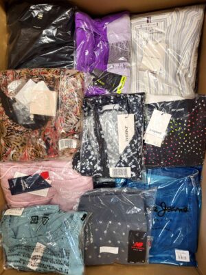 The photo shows a package with clothing in the category AW.