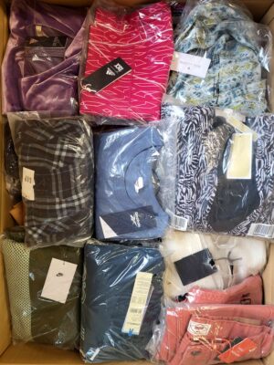 The photo shows a package with clothing in the category AW.