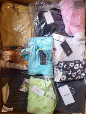 The photo shows a package with clothing in the category AW.