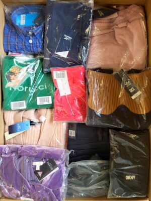 The photo shows a package with clothing in the category AW.