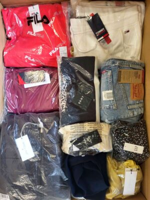The photo shows a package with clothing in the category AW.